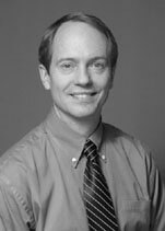 Black and white photograph of Greg Downey, MD.