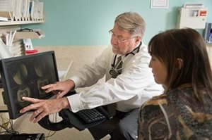 Doctor Rollins with a patient
