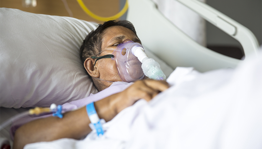 How is a critical case of COVID-19 treated?