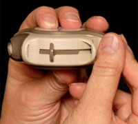 Push your thumb away from you until the Diskus® clicks. This will open the Diskus® so you can see the mouthpiece.