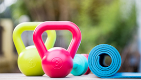 kettlebells and yoga mat