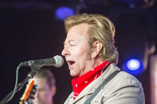 Brian Setzer singing into microphone