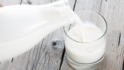 Pouring a glass of milk