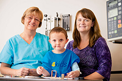 Cathy Hancock, RN, with Quentin and Lisa Clark