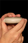 Step 2: Place the thumb of the other hand on the Diskus thumb grip.