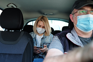 Using Local Transportation: Wearing a facemask in a taxi