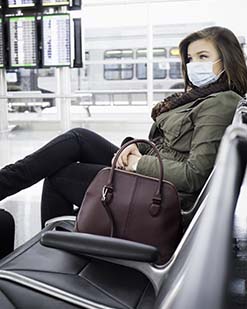 Woman wearing a facemask at the airport