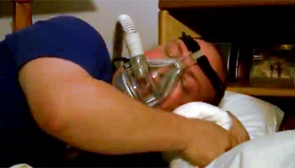 Patient sleeping with a CPAP machine