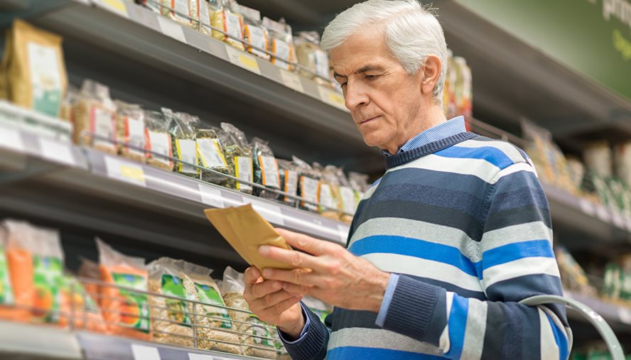 person looking at food labels