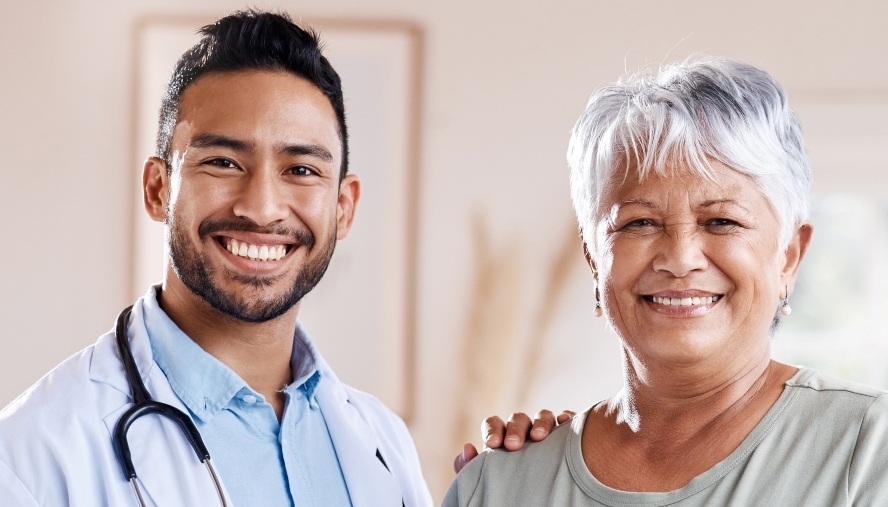 physician and patient smiling