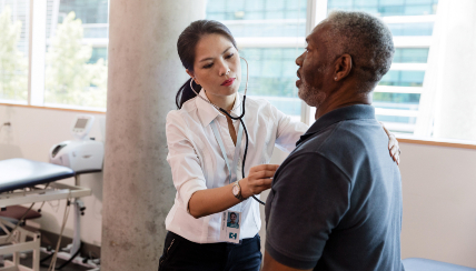 Doctor examining patient's chest