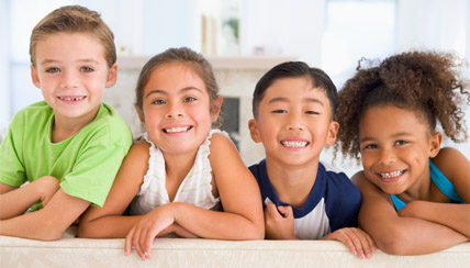 four smiling children