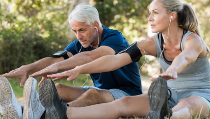 Joggers stretching before jogging