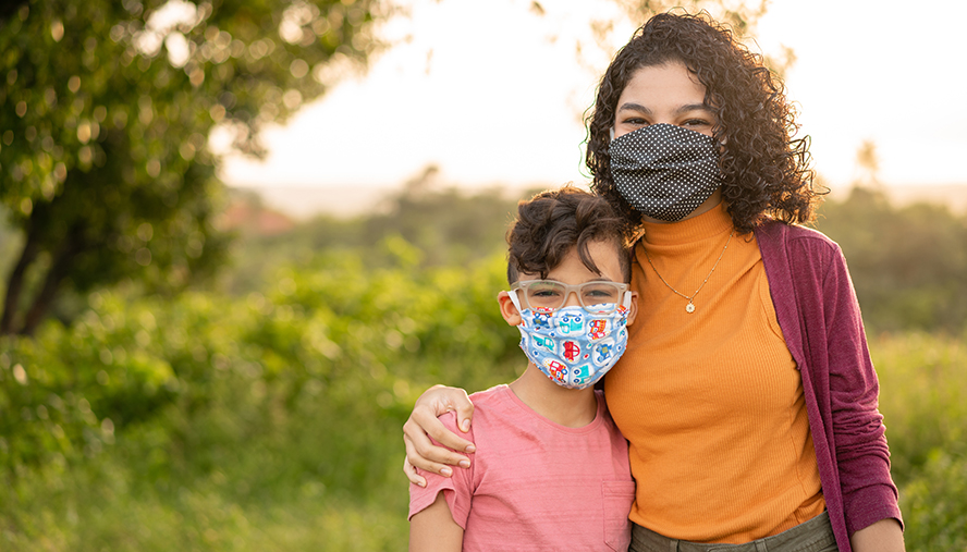 Woman and child wearing masks to protect from allergies