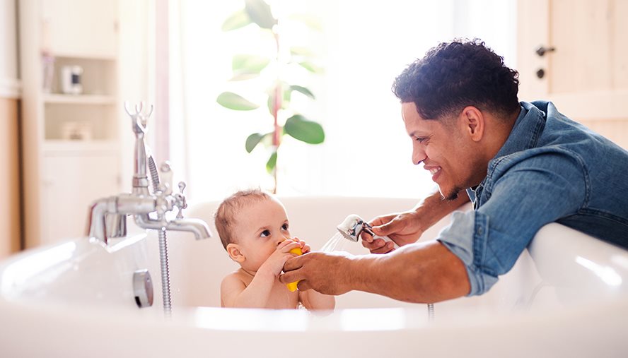 Father bathing their child