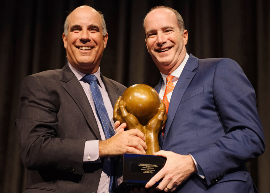 Dinner Chair Daniel Cott (left) presents Honoree Barry L. Bobrow with National Jewish Health Humanitarian Award in New York City on March 16.