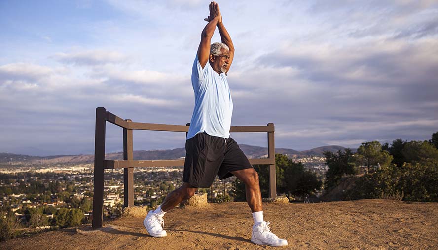 Man doing yoga to reduce stress