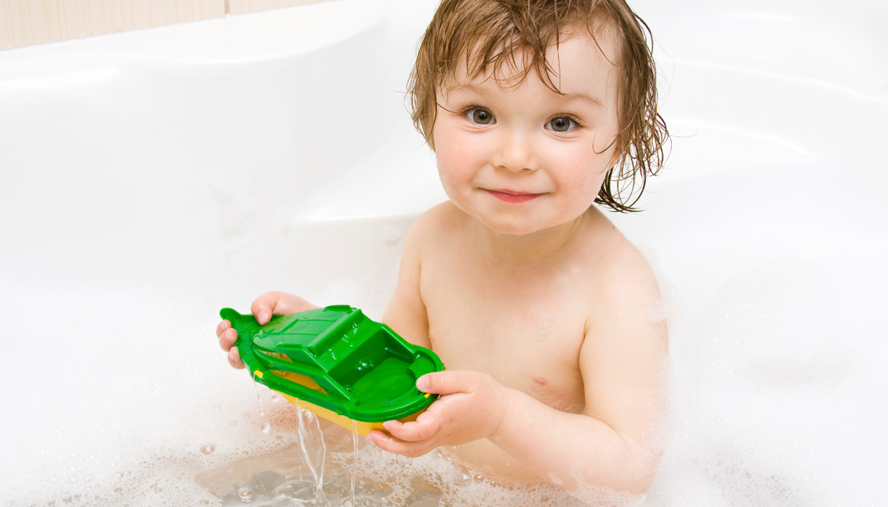 child with eczema in the bath