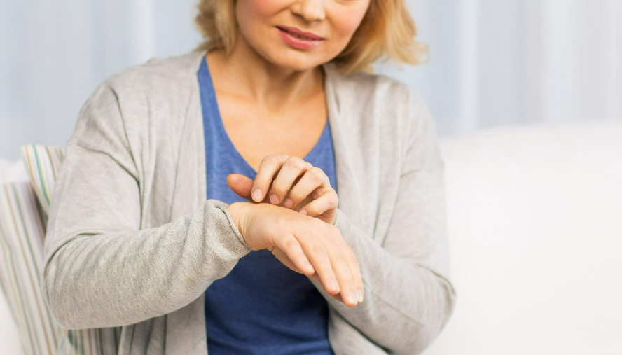 Woman grasping her hands