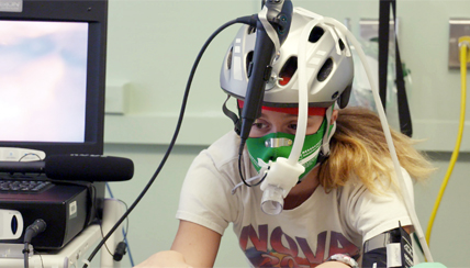 Patient undergoing a strenuous workout on a stationary bicycle