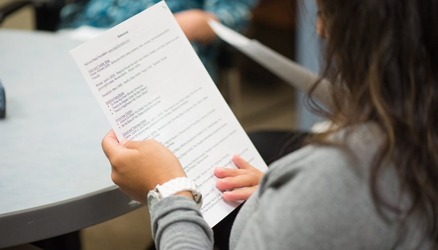 woman looking at menu