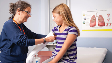 Physician treating eczema patient Physician treating eczema patient