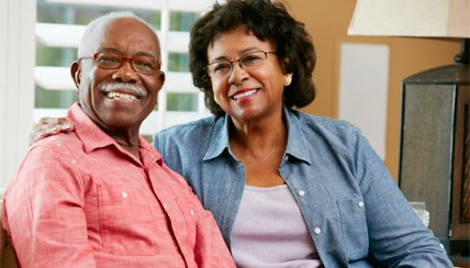 Two senior citizens looking lovingly