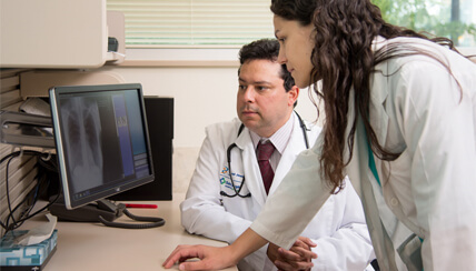 doctors looking at computer doctors looking at computer