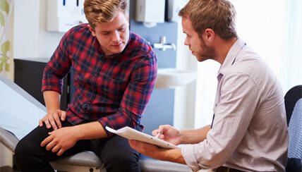 physician and patient reviewing medical history