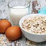 Oatmeal, eggs, and glass of milk