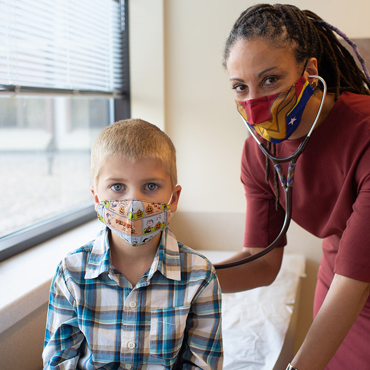 Pediatric physician with patient.