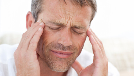 Man rubbing his temples