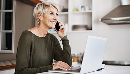 Social Distancing: Woman sitting at her laptop