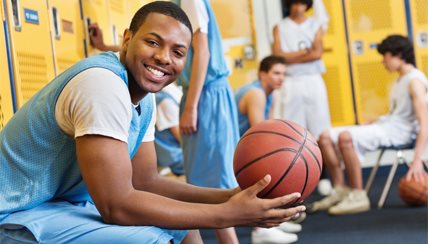 smiling young man with basketball