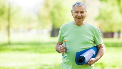 old man with yoga mat