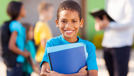 child smiling at school