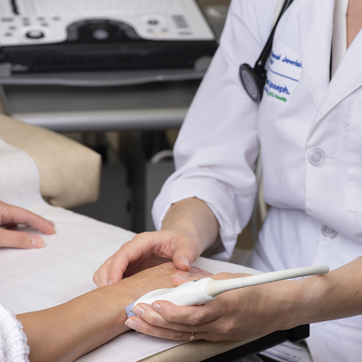 Physician examining hand